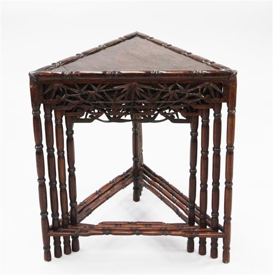 An unusual Chinese rosewood triangular shaped nest of quartetto tables, W.2ft